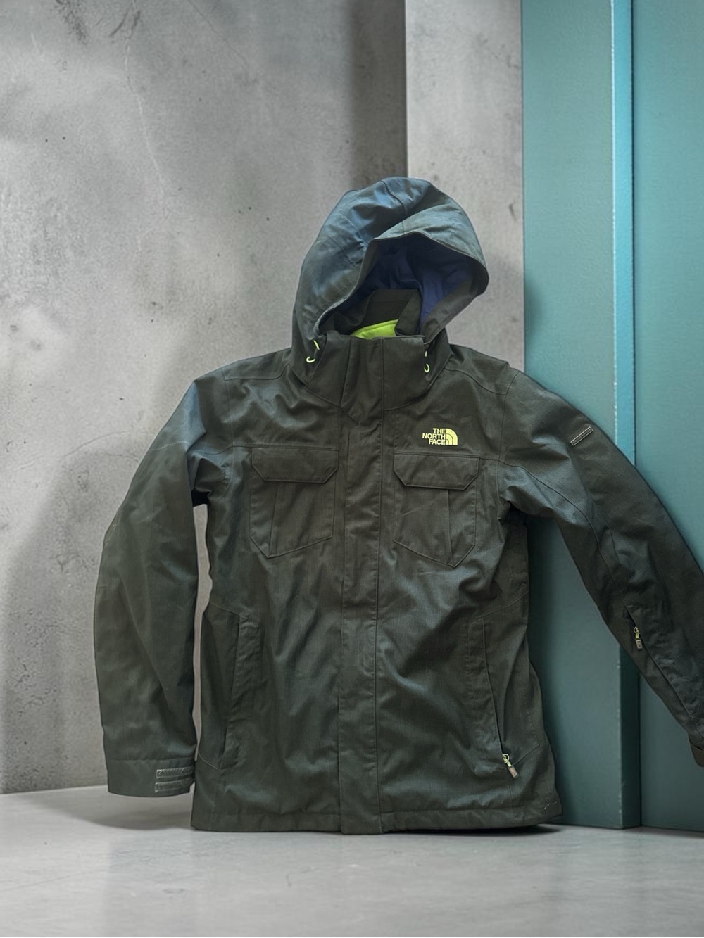 The North Face men’s Hooded Raincoat - Olive Green with Lime Accent